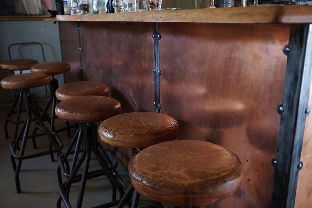 leather stools at a bar